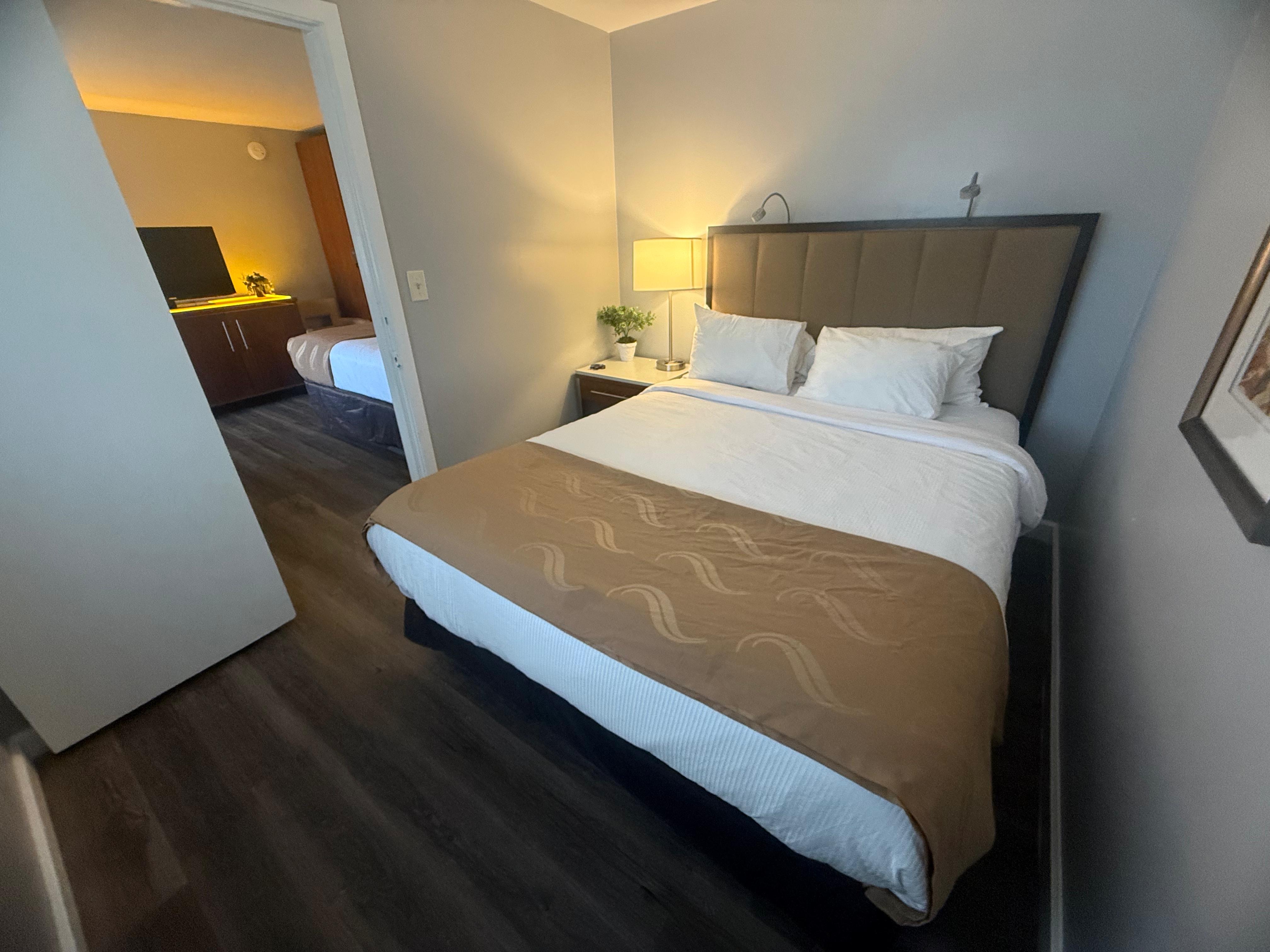 Two queen beds with one private room